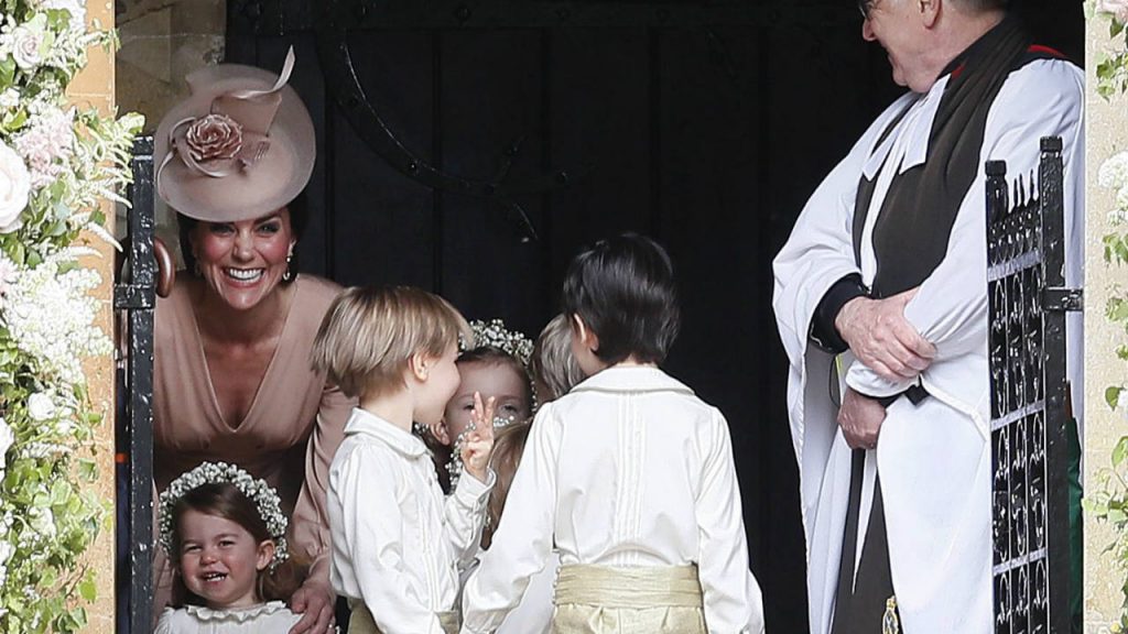 Princess Charlotte and Kate smiling at Pippa Middleton's wedding
