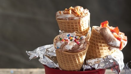 ice cream cones filled with melted marshmallow and chocolate