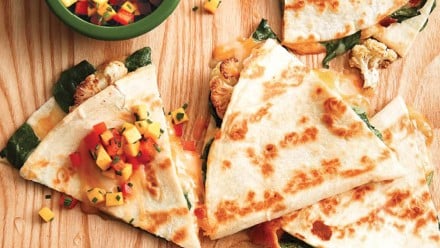 Quesadillas filled with peppers, mango and herbs