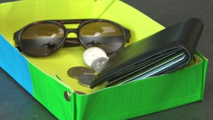 Duct tape tray with wallet, keys and sunglasses inside