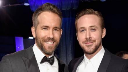 Ryan Gosling and Ryan Reynolds in tuxes smiling at the camera together