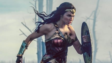 Gal Gadot as Wonder Woman running with shield
