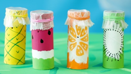 Toilet paper rolls with painted fruit on them