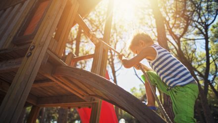 Boy climbing on playground