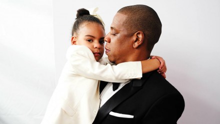 Jay-Z holding onto Blue Ivy