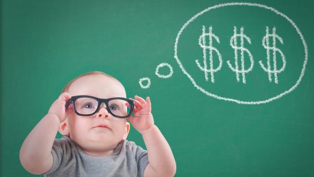 Baby wearing glasses dreaming about money, tips on how to get the most out of your kids' RESP savings