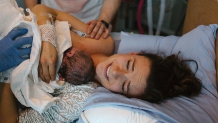 New mom holding her newborn in the hospital