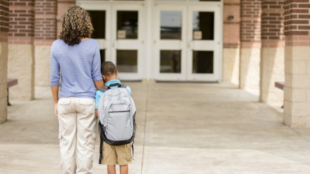 Little boy with his mom, nervous about first day of school