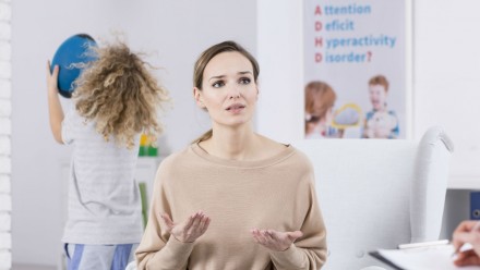 woman with child with ADHD in therapist's office