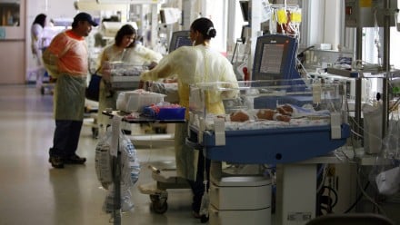 Doctors helping babies in the NICU