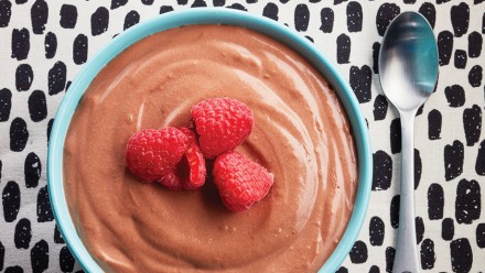 bowl of chocolate mousse with raspberries
