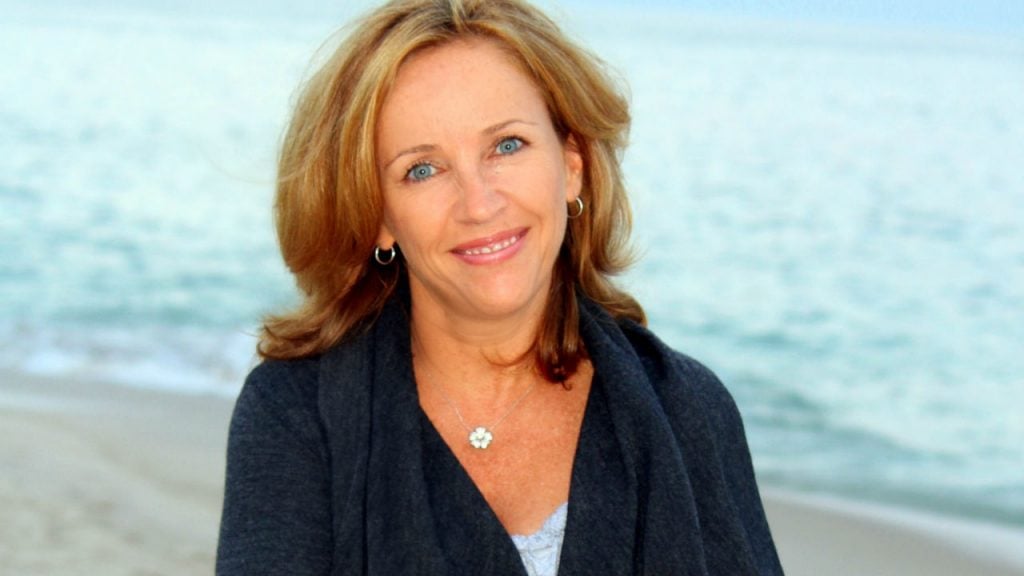 headshot of author laurie gelman on beach