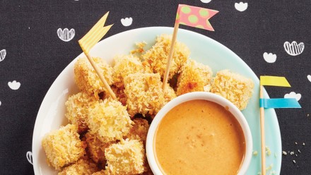 plate of breaded tofu croutons with dip
