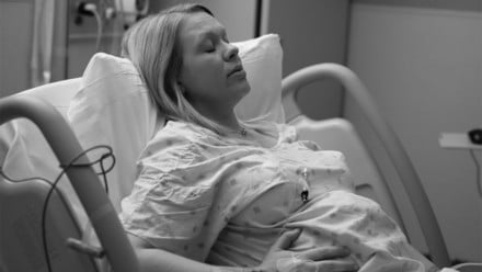 Woman practicing breathing for pain management during labour