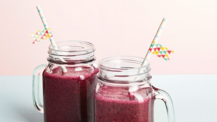 two glass mugs with purple smoothie