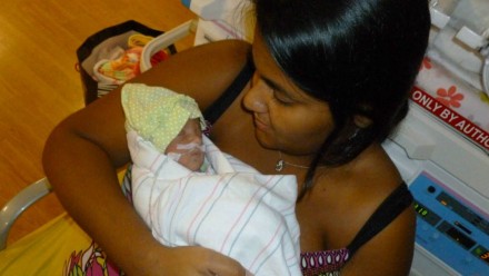 A mom holding her preemie baby