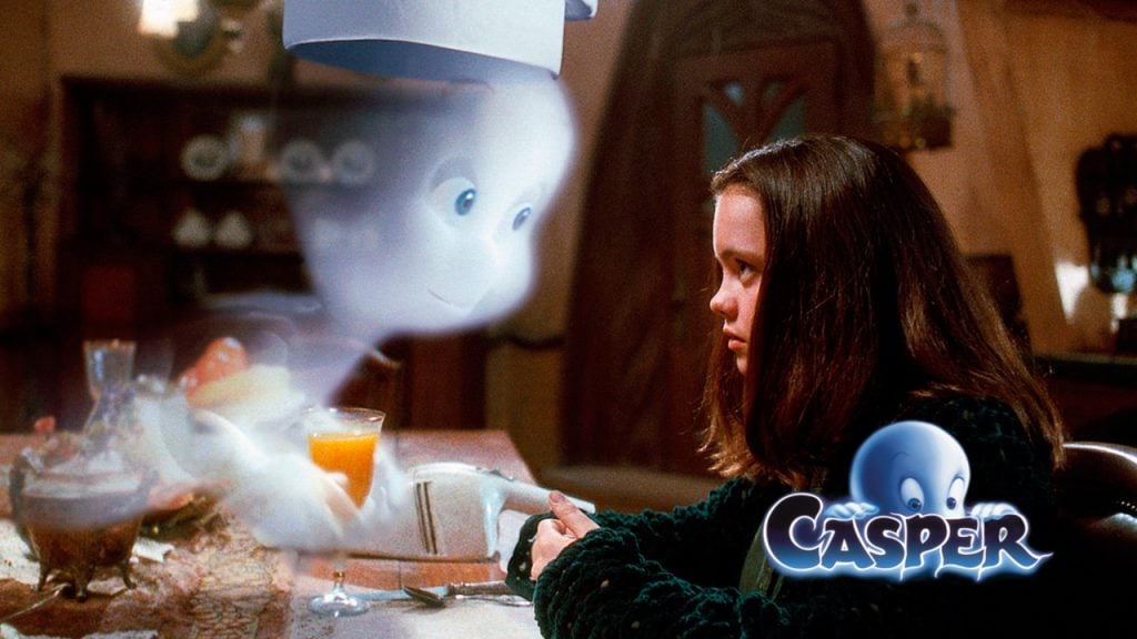 Casper the friendly ghost looks at a girl while wearing a chef's hat. The Casper movie logo is in the corner