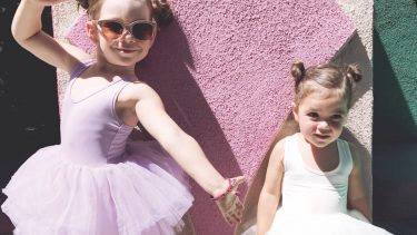 Two little girls dressed up in ballerina outfits