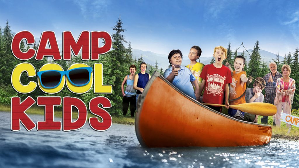 Promo Image for Camp Cool Kids. shows a group of kids standing in a canoes