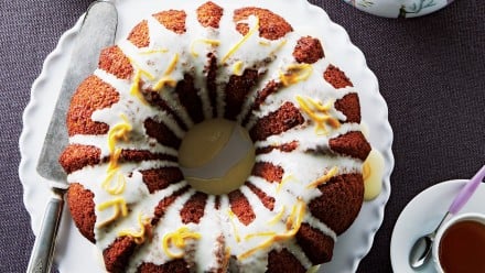 Gingerbread bundt cake with white glaze and shaved citrus peel