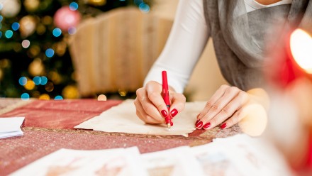 Woman writing a Christmas letter