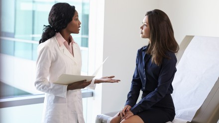 Female Doctor Meeting With Female Patient In Exam Room