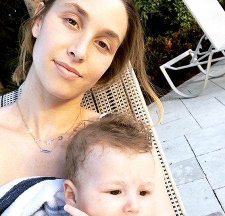 Whitney Port sits with her baby