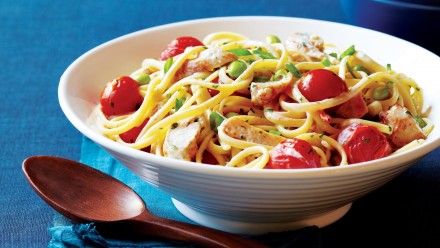 Bowl of creamy pasta with roasted tomatoes and chicken