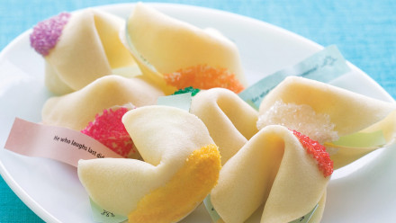 plate of fortune cookies with colourful sprinkles