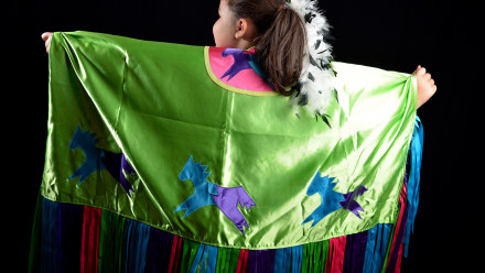 Stacey's daughter dressed in her Indigenous dancing regalia