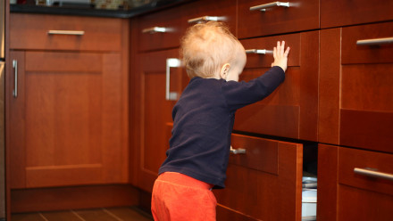 Toddler opening drawers