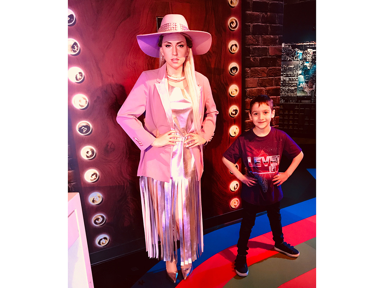 Deputy Editor, Leah Rumack's son, Ben, beside a wax figure of Lady Gaga