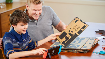 Dad and son preparing to build with Nintendo Labo
