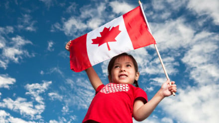 Photo of a little girl with Canadian flag