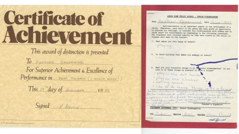 A kids' certificate of achievement and an old report card