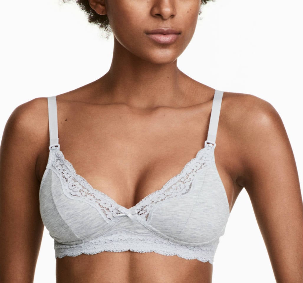 Woman wearing one of the best nursing bras,  lacy and grey