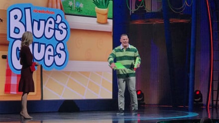 John Cena in a striped green polo shirt auditions on the set of blues clues