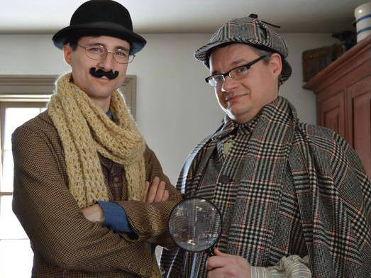 Two men dressed up as detectives