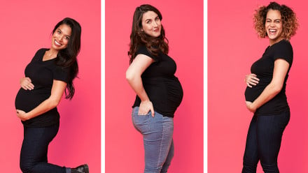 Three pregnant women posing in maternity jeans