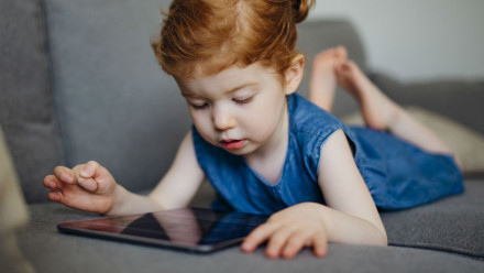 Toddler on a tablet.