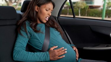 Pregnant woman experiencing signs of labour