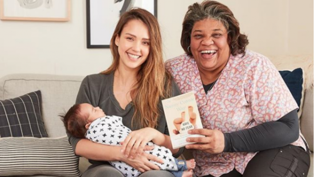 Jessica Alba sitting on couch with nannie connie and her baby in her lap.
