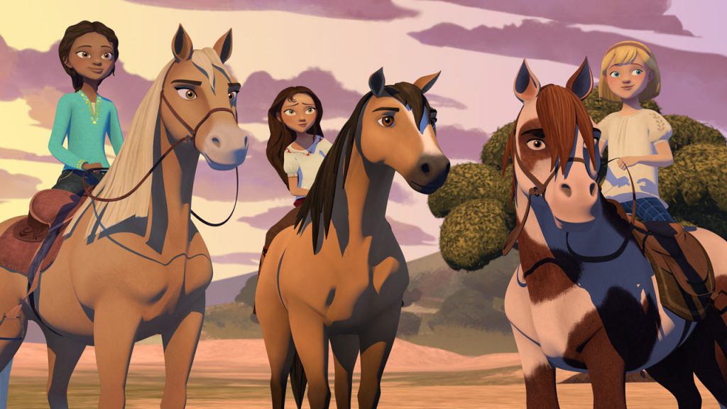 three horses with girls riding them