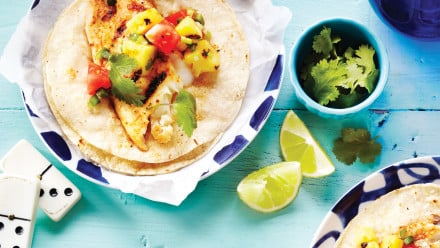 tortillas with grilled fish, pineapple, tomato, cilantro and lime