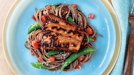plate of soba noodles and veggies topped with charred salmon
