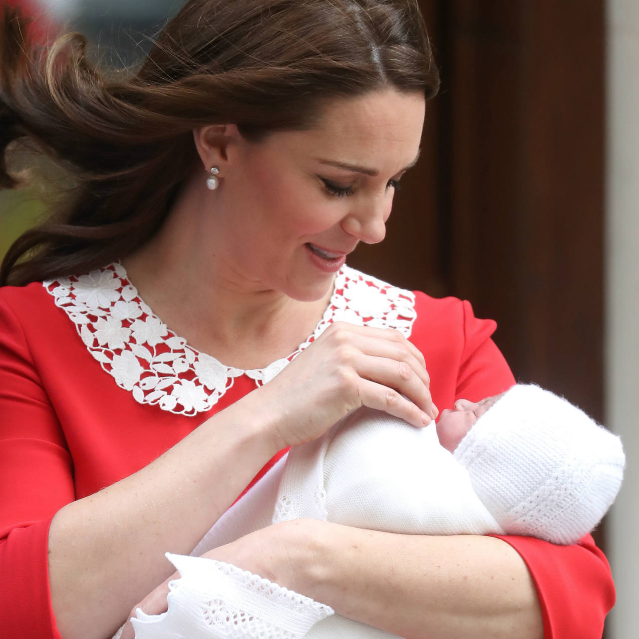 Kate looks down at the royal baby