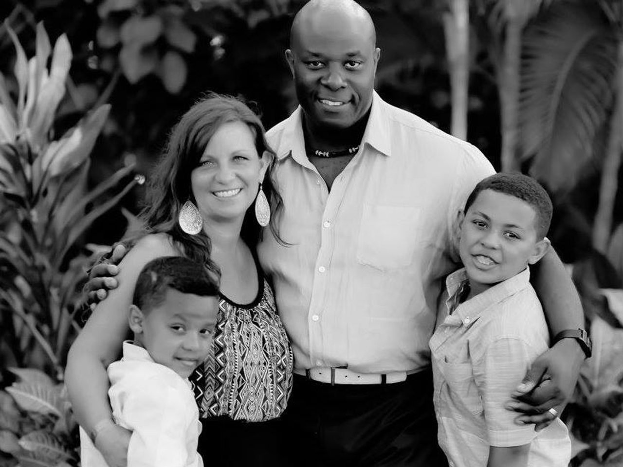 Black and white photo of Heather Hamilton, her husband and two sons