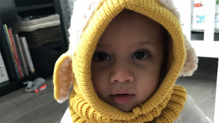Photo of Elamin Abdelmahmoud's daughter wearing a knit hat with ears