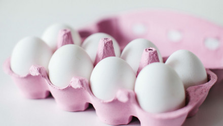 Eight eggs in a pink egg carton