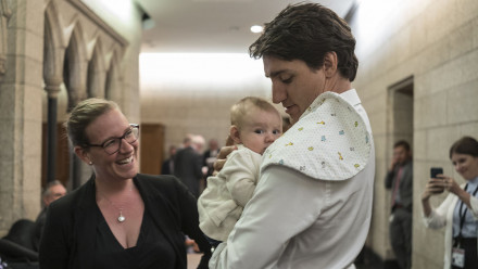Prime Minister Justin Trudeau holds Karina Gould's son, Oliver